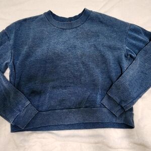 blue sweater up to the navel